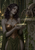 Gray-skinned, pointed-eared woman in bronze-toned armor holds a decorated bowl beside a large spider on carved stone.