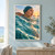 An adult swimmer in a dark teal cap surfaces amid sparkling waves, facing a low sunset.; frame shown for styling only