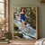 A barefoot red-haired woman in a blue dress walks across a smooth ribbon of water above a wooded stream.; frame shown for styling only