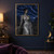Pointed-eared dark elf in a silver pleated gown seated on a rocky ledge above a valley beneath a layered blue night sky.; frame shown for styling only