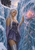 Pale-haired woman in a purple embroidered dress touches a glowing pink lotus-like flower in ice as a wolf peers from an upper ledge.