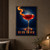 Ruby-red cocktail in a stemmed coupe with a curling orange-peel garnish and “RUBY HOUR” lettering on a dark blue background.; frame shown for styling only