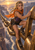 Blonde woman in an orange scarf climbs oversized chain links against a sunset canyon.