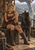 Blonde fantasy scout seated beside a large dark wolf on a wooden platform, with a mountain valley and distant settlement beyond a stone opening.