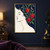 Stylized closed-eye woman’s profile entwined with leafy branches and three red pomegranates, with a crescent moon and star on a dark blue field.; frame shown for styling only