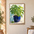 Leafy basil plant in a cobalt-blue pot on a tabletop, with a loose leaf and diagonal morning light.; frame shown for styling only