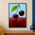 Two glossy burgundy cherries and a green leaf above a red liquid splash on a pale blue background.; frame shown for styling only