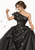 Woman in a voluminous black gown with star-like lights and connecting lines, holding a delicate strand.