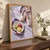 Pale pink ballet slippers with plum ribbons beside three colorful macarons on a gold-rimmed plate over a pale lilac floor.; frame shown for styling only