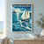 Cream-sailed schooner and three leaping dolphins amid teal waves, with distant islands and a bright compass-like sunburst.; frame shown for styling only