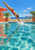 Red-suited swimmer dives into a turquoise pool beside palms, a coral parasol, and stucco walls.