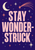 Pale-pink “STAY WONDER-STRUCK” lettering on violet with a crescent moon, stars, mint dots, and comet trails.