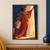 Smiling woman in a flowing burnt-orange gown reaching to open an indigo curtain beside a bright window.; frame shown for styling only