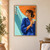 Adult woman in a cobalt jacket beneath an orange parasol, holding a glass with bubbles and an orange slice beside a turquoise wall.; frame shown for styling only