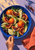 Overhead view of blood oranges, fennel and olives in a cobalt bowl, with a hand holding a fork, a tipped glass and coral napkin.