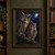 Two horned owls perch close together on a dark branch beneath pine foliage, with amber eyes and a bright moon in a midnight-blue sky.; frame shown for styling only
