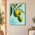 Three green and golden olives on a leafy branch against a pale aqua background.; frame shown for styling only