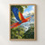 Scarlet macaw flying diagonally above a forest canopy, framed by dark green leaves against a bright sky.; frame shown for styling only
