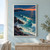A large turquoise wave curls into a rocky cove, with dark foreground rocks, a distant headland and an apricot sunset.; frame shown for styling only