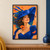 Smiling woman in a sweeping cobalt-blue hat steadies the brim and holds an orange-red poppy against an apricot background.; frame shown for styling only