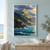 Dramatic sunlit coastal mountains above turquoise water, with a small red-sailed cutter, rocky headland, storm clouds, and seabirds.; frame shown for styling only