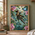 A woman floats diagonally through a glasshouse among pink orchids and ferns, reaching for a glowing blue insect while holding a notebook.; frame shown for styling only
