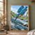 Blue-green kingfisher with orange breast diving toward a small silver fish and white splash in a rushing stream.; frame shown for styling only