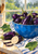 Glossy purple eggplants and sliced pieces in a bright blue bowl beside leafy greens, a striped towel, and a rain-streaked window.
