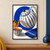 Cream ceramic teapot with blue stripes pouring amber tea into a cup against an ultramarine oval, with a blue towel and orange.; frame shown for styling only