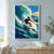Adult surfer on a white shortboard beneath a curling blue wave, with white spray, a coastal headland, and an orange sun.; frame shown for styling only