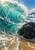 Turquoise wave curling around a dark rounded rock, with white crest spray and foam spreading across golden wet sand.