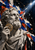 Bearded marble astronomer bust holding a brass-colored circular instrument beside the face, against colorful collage fragments and star charts.