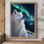 White wolf looking upward beneath green aurora, with snowy evergreen forest, mountains, and a valley.; frame shown for styling only