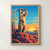 An upright meerkat shades its eyes while looking across a desert horizon from a red sandstone ledge beneath a blue and gold sky.; frame shown for styling only