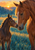 A chestnut mare and a smaller dark brown foal touch muzzles in warm sunrise light above a blue-green meadow.