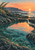Rocky coastal tide pool reflecting an orange-pink sunset, with grasses at left, a small cascade at right, and a distant headland.