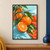 Whole and cut orange tangerines with glossy green leaves on a branch over orange-red cloth and a pale aqua background.; frame shown for styling only