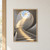 Pale curved stone staircase rising toward a circular skylight, with a dark handrail and sunlight across the steps.; frame shown for styling only