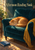 Sleeping ginger cat curled on a deep teal armchair beneath the title Afternoon Reading Nook, with a saffron throw, blue book, window, and plant.