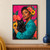 Short-haired woman in teal holding a black cat with bright eyes, framed by coral and yellow flowers against fuchsia.; frame shown for styling only