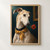 Pale greyhound in a dark blue collar and ochre scarf holding a red flower against a deep teal gallery-like background.; frame shown for styling only
