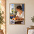 Adult woman in profile cuts a peach at a sunlit table beside a blue bowl of peaches and a vase of leaves.; frame shown for styling only