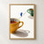 Tiny figure in a blue coat balances on a black line between an ochre teacup and a smaller green floral teacup on a warm-white background.; frame shown for styling only
