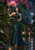 A woman in a teal gown looks up at a large pink-purple orchid amid glossy leaves on a moonlit, rain-wet terrace.