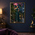 A woman in a teal gown looks up at a large pink-purple orchid amid glossy leaves on a moonlit, rain-wet terrace.; frame shown for styling only