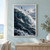 Three dark seabirds fly above a large curling blue-green ocean wave with white foam beneath a pale cloudy sky.; frame shown for styling only