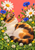 Curled sleeping calico cat among clover, white daisies, blue cornflowers, and yellow flowers, with a butterfly near its nose.