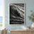 A black-and-white ocean swell curls diagonally into a bright lace-edged crest above dark, textured water.; frame shown for styling only