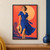 Adult woman in a cobalt wrap dress holding a straw hat against a coral background with a peach sun-disc and indigo plant.; frame shown for styling only