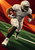 A helmeted football player in a white uniform runs with a brown ball against a burgundy and burnt-orange geometric background.